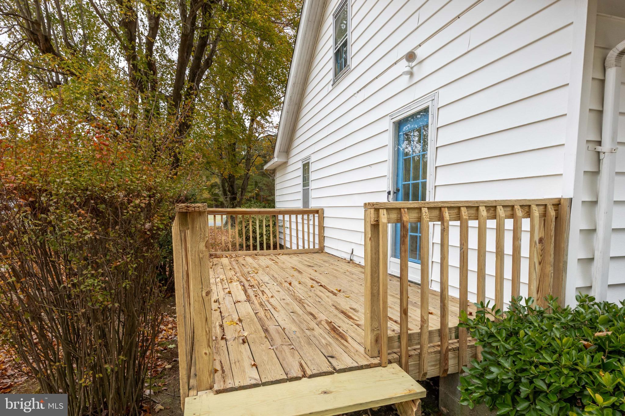 28766 Larry Lankford Road Princess Anne, MD 21853 - Photo 33 of 38 a view of a balcony with wooden floor and fence