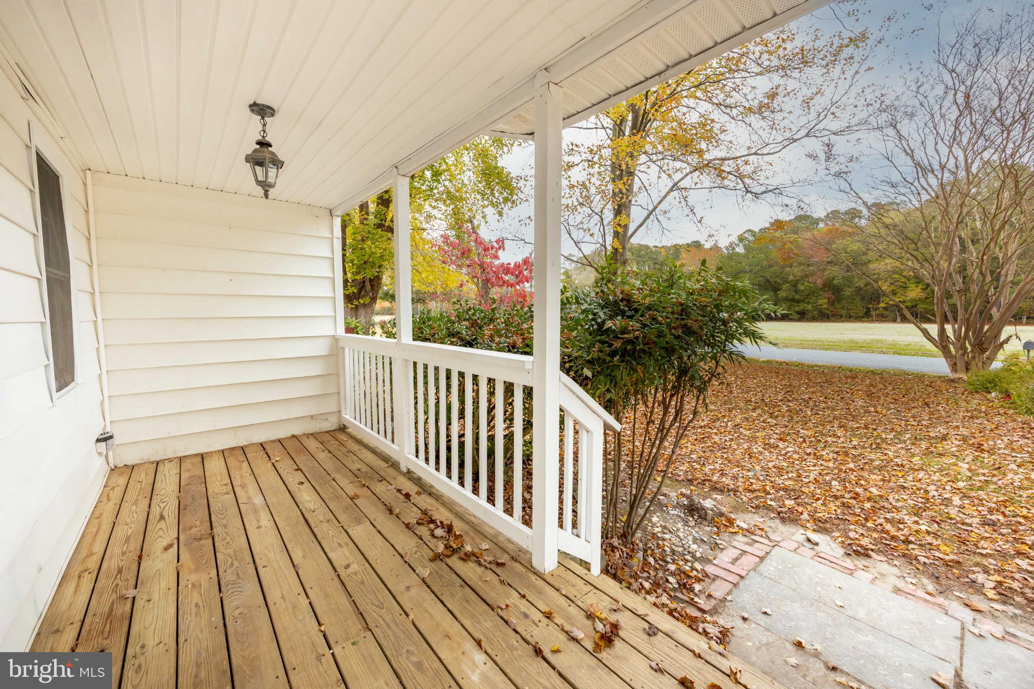 28766 Larry Lankford Road Princess Anne, MD 21853 - Photo 6 of 38 a view of a porch with wooden floor and fence