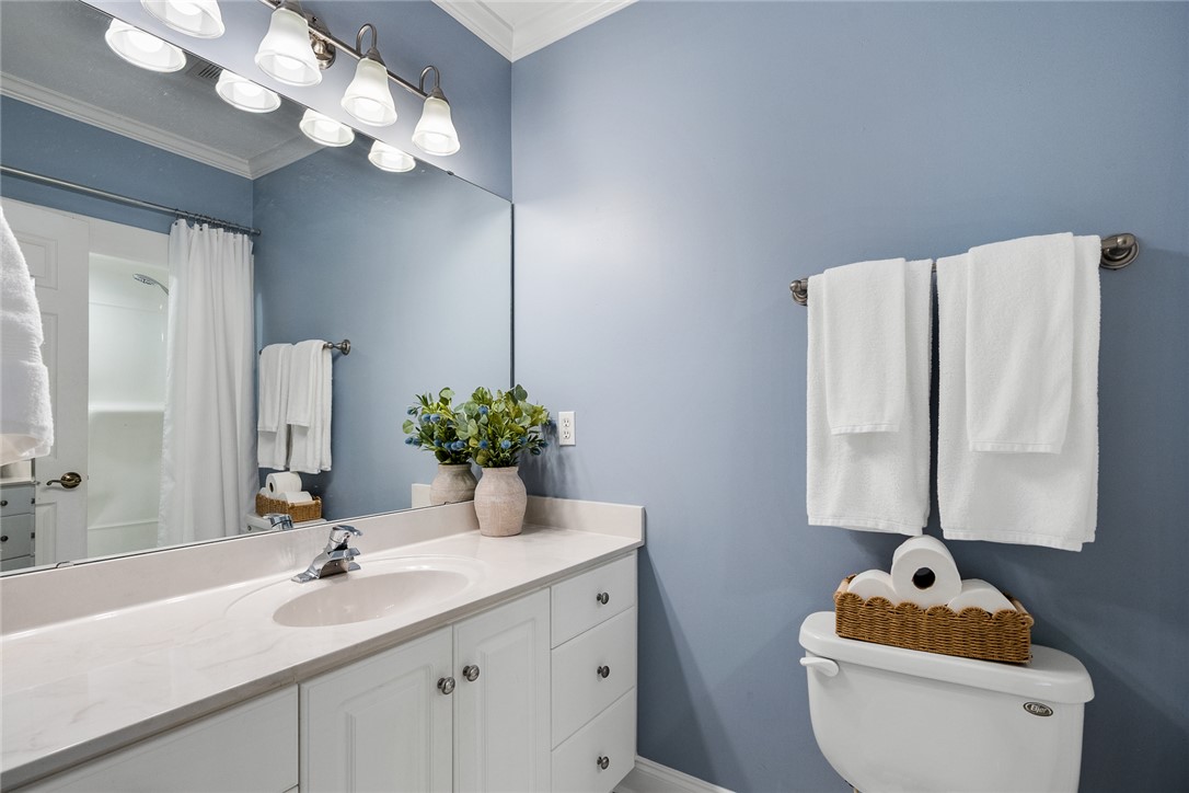 200 Graylyn Drive Anderson, SC 29621 - Photo 30 of 48 A pristine bathroom featuring a classic vanity, ample counter space, and a well-appointed commode area.