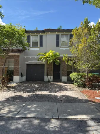 a front view of a house with yard