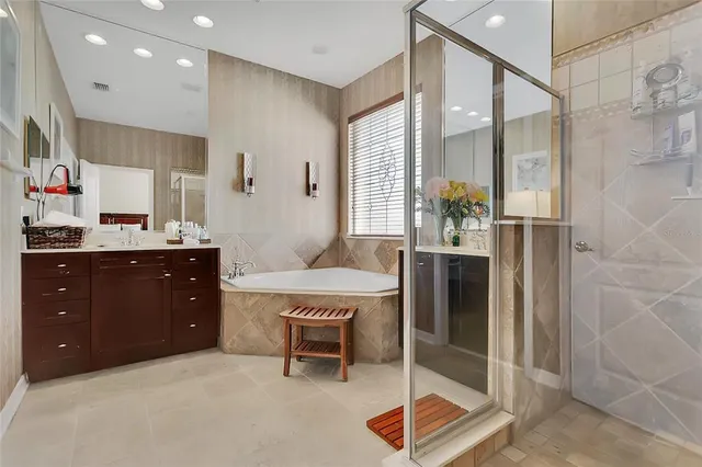 a bathroom with a tub and a shower