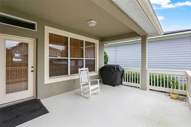 a view of a patio with a backyard