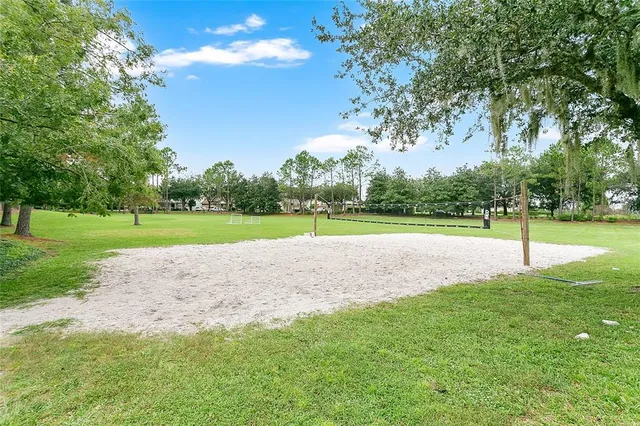 an aerial view of a house with a lake view