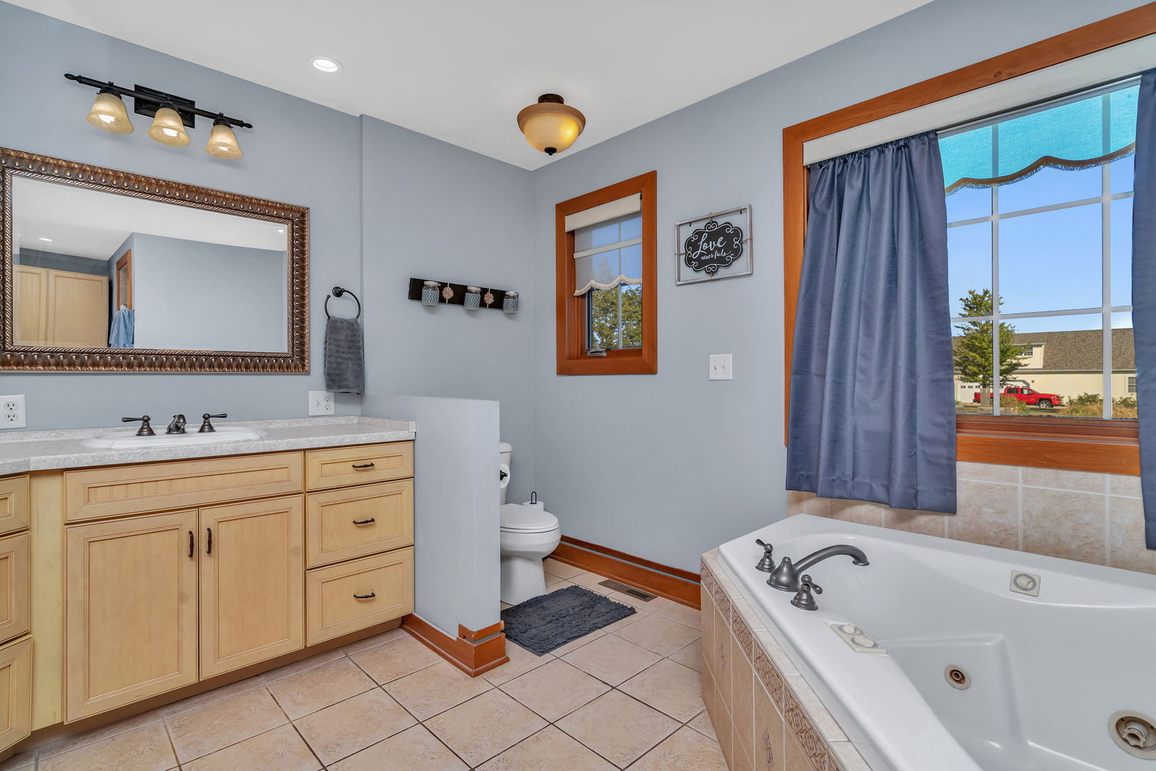 2624 East 21st Road Marseilles, IL 61341 - Photo 29 of 74 a bathroom with a tub sink and mirror