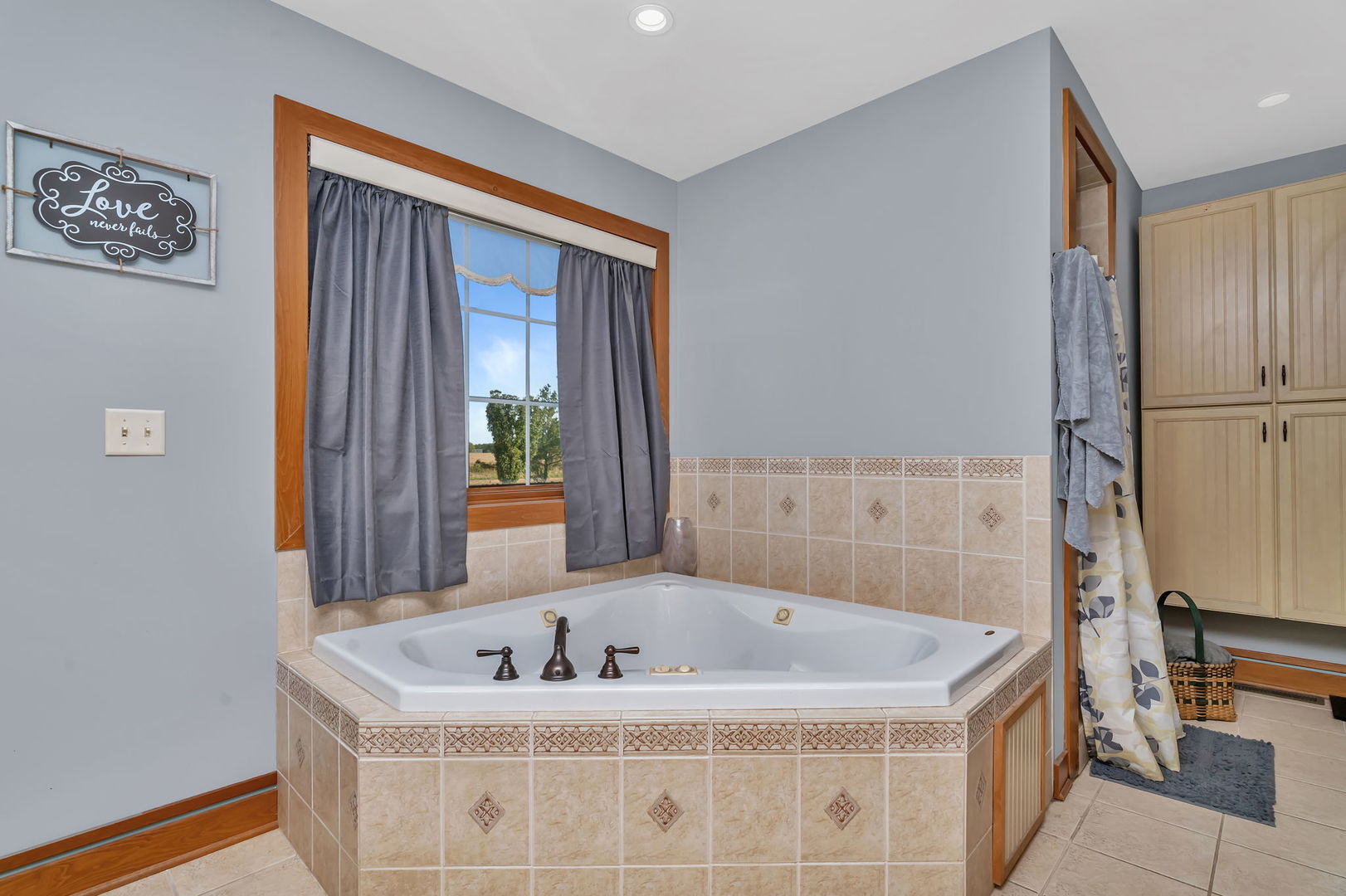 2624 East 21st Road Marseilles, IL 61341 - Photo 30 of 74 a bath tub sitting in a bathroom next to a window