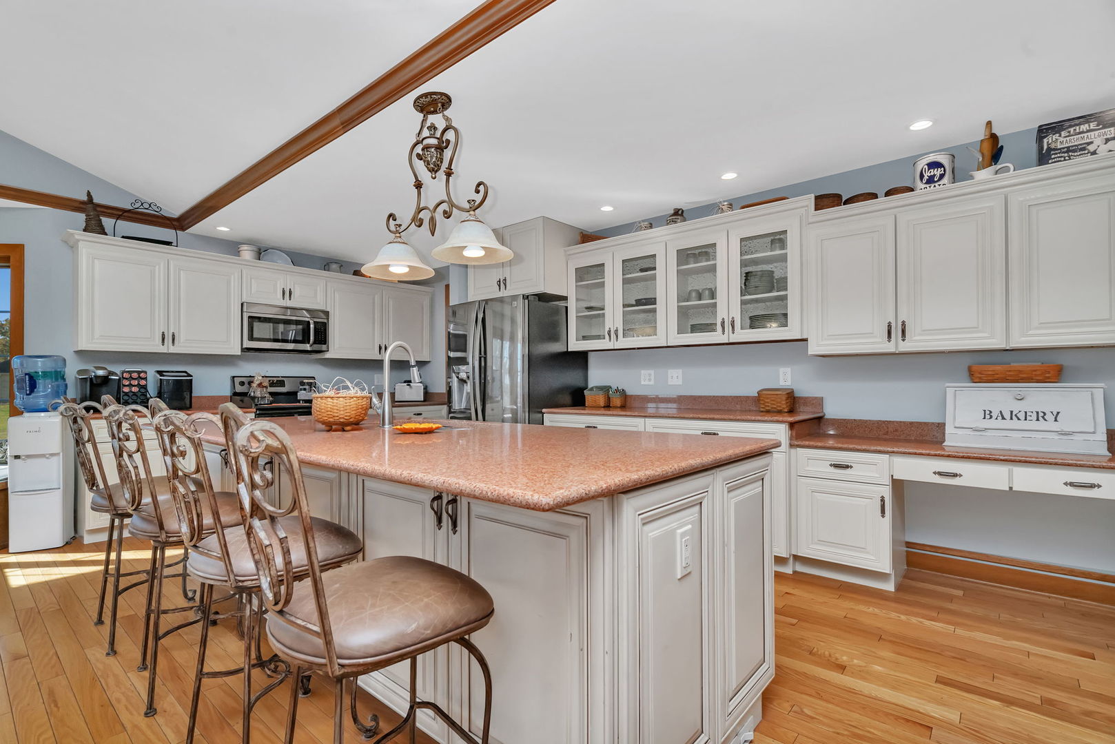 2624 East 21st Road Marseilles, IL 61341 - Photo 9 of 74 a kitchen with stainless steel appliances granite countertop a stove top oven a sink a dining table and chairs with wooden floor