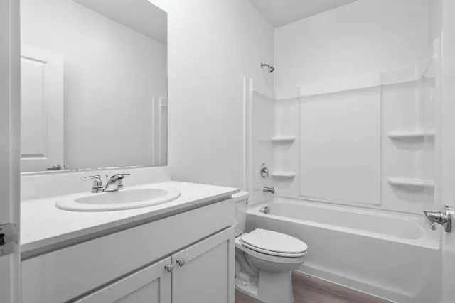 a bathroom with a sink a toilet and a bathtub