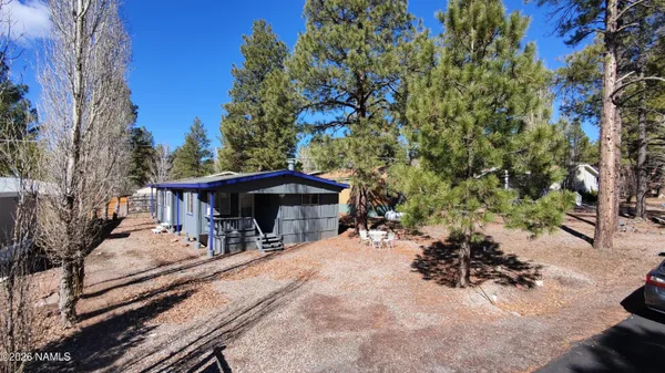 a view of a backyard with a sitting area
