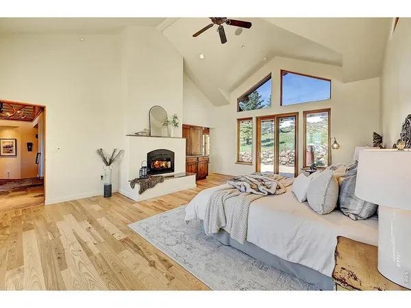 a bedroom with a large bed and a tv