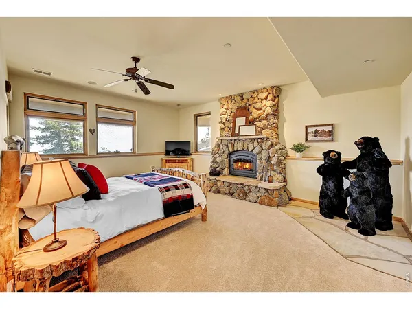 a bed room with a bed and a large window
