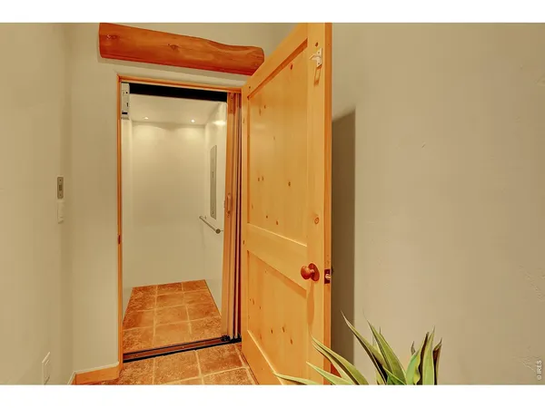 a bedroom with furniture and a flat screen tv