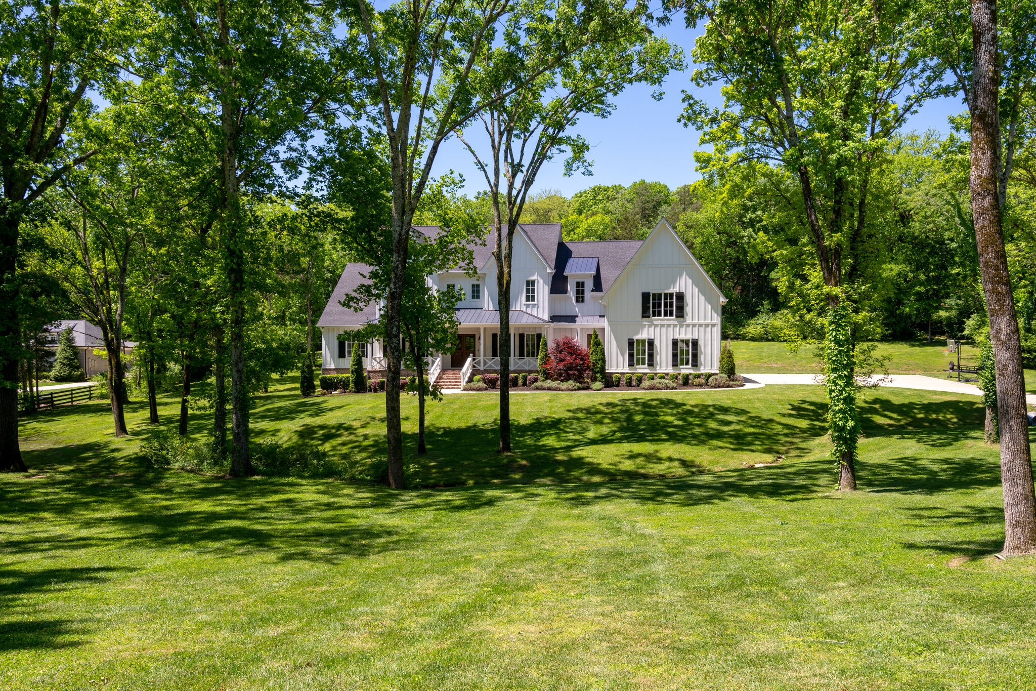 1453 Sneed Road West Franklin, TN 37069 - Photo 2 of 50 a front view of a house with a yard
