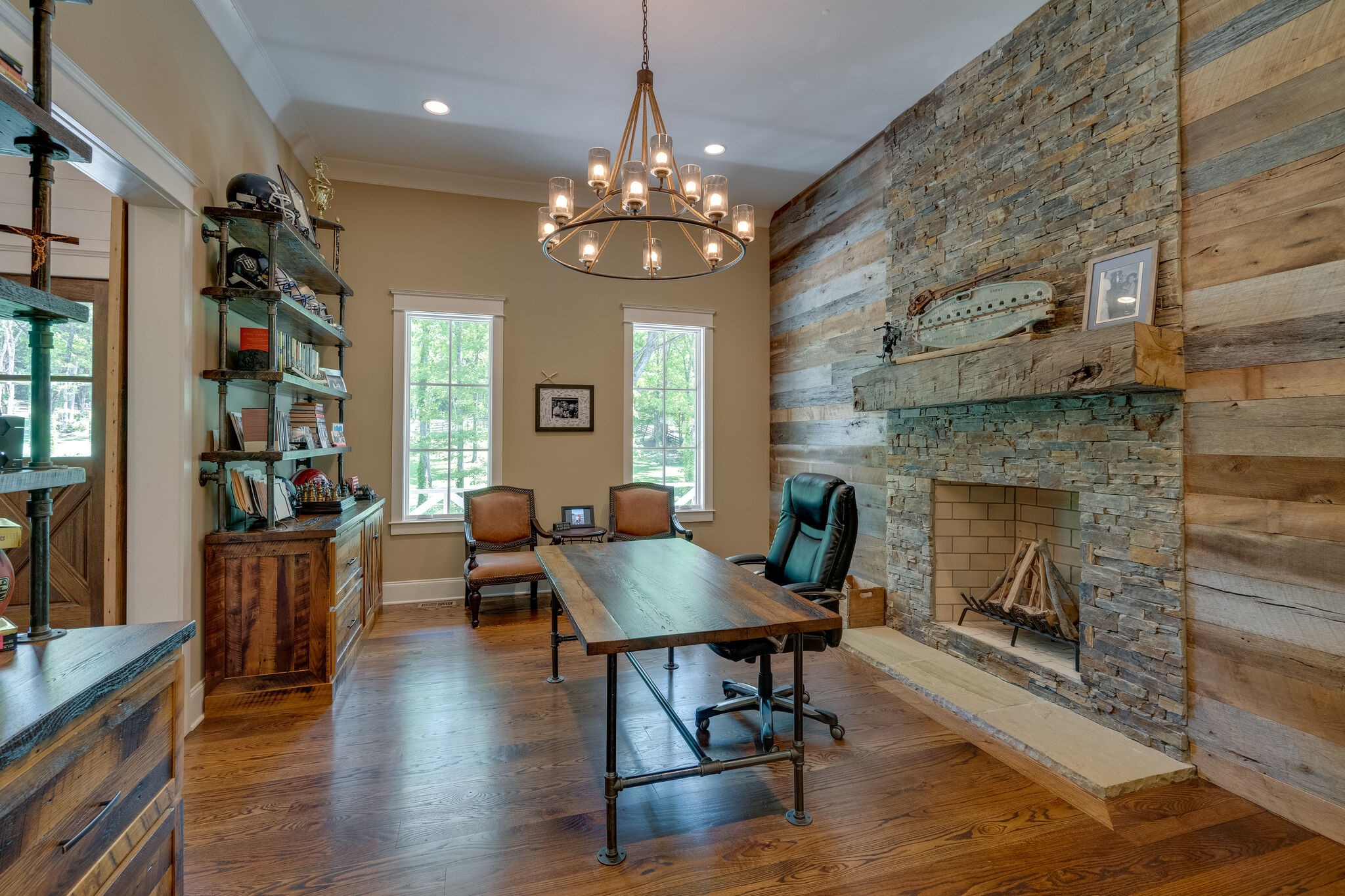 1453 Sneed Road West Franklin, TN 37069 - Photo 14 of 50 a dining room with furniture a fireplace and wooden floor