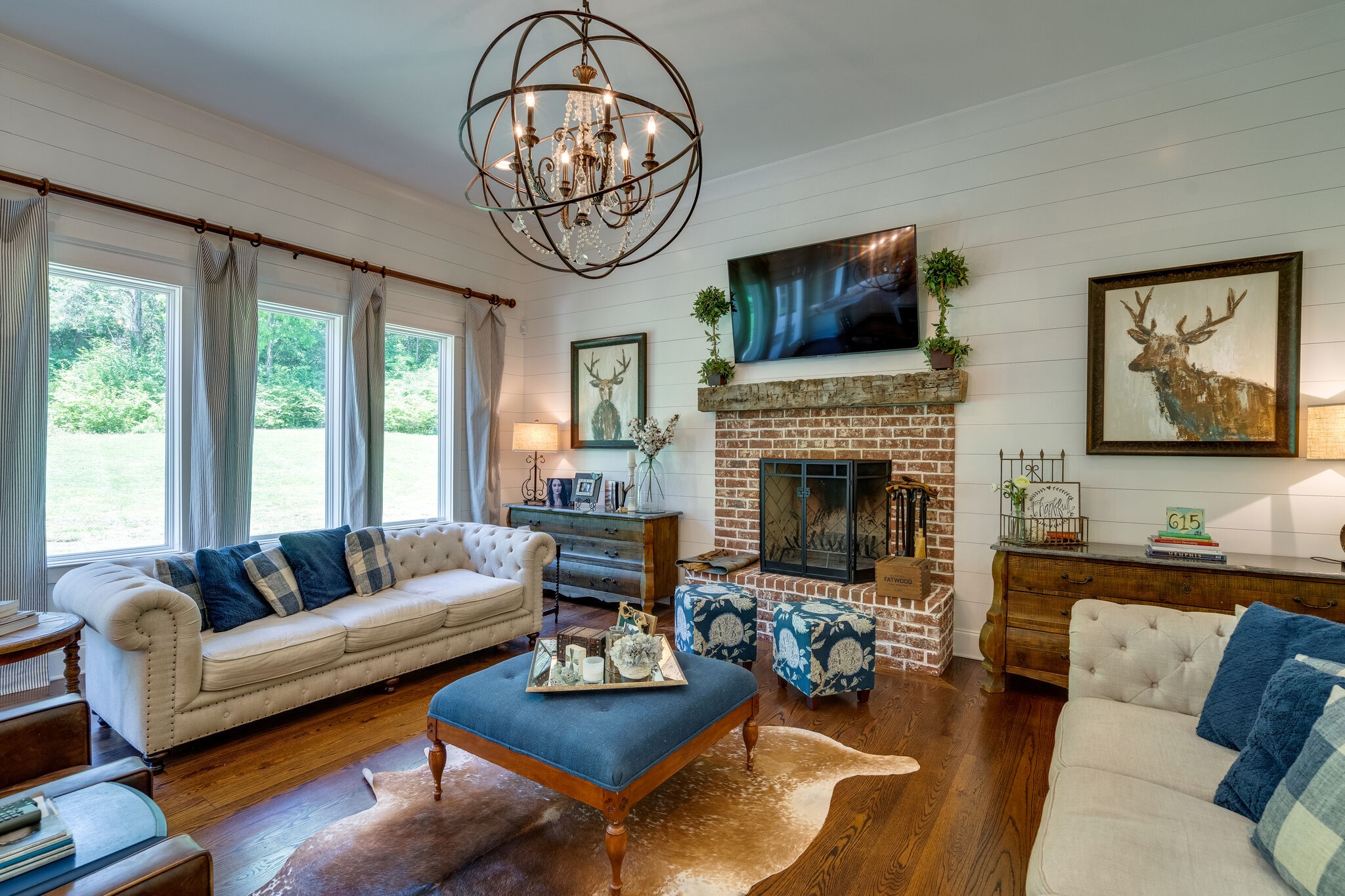 1453 Sneed Road West Franklin, TN 37069 - Photo 19 of 50 a living room with furniture chandelier and a fireplace