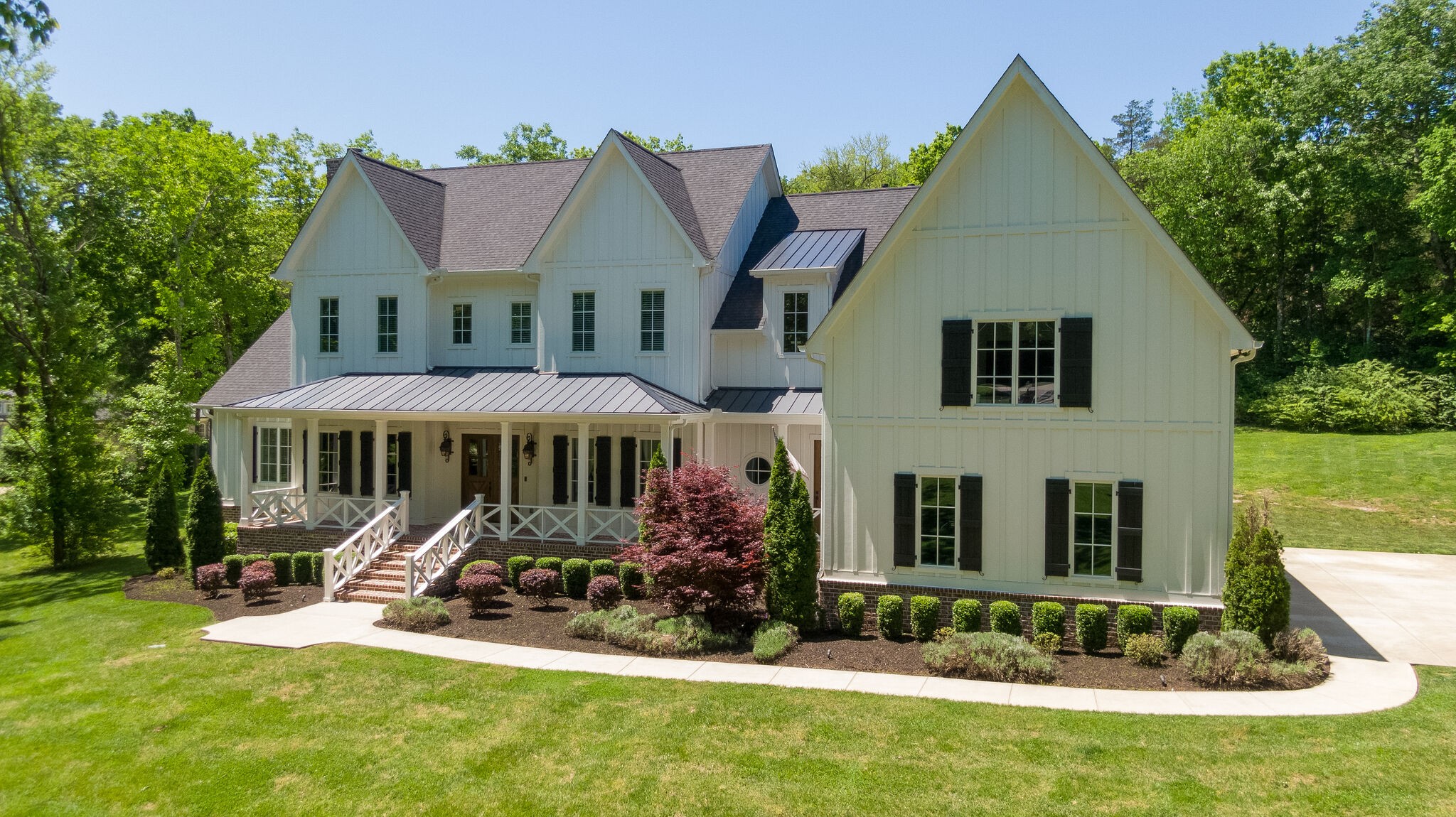1453 Sneed Road West Franklin, TN 37069 - Photo 3 of 50 a front view of a house with a yard