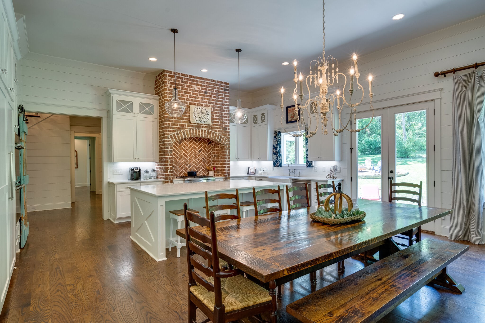 1453 Sneed Road West Franklin, TN 37069 - Photo 21 of 50 a view of a dining room with furniture a chandelier and wooden floor