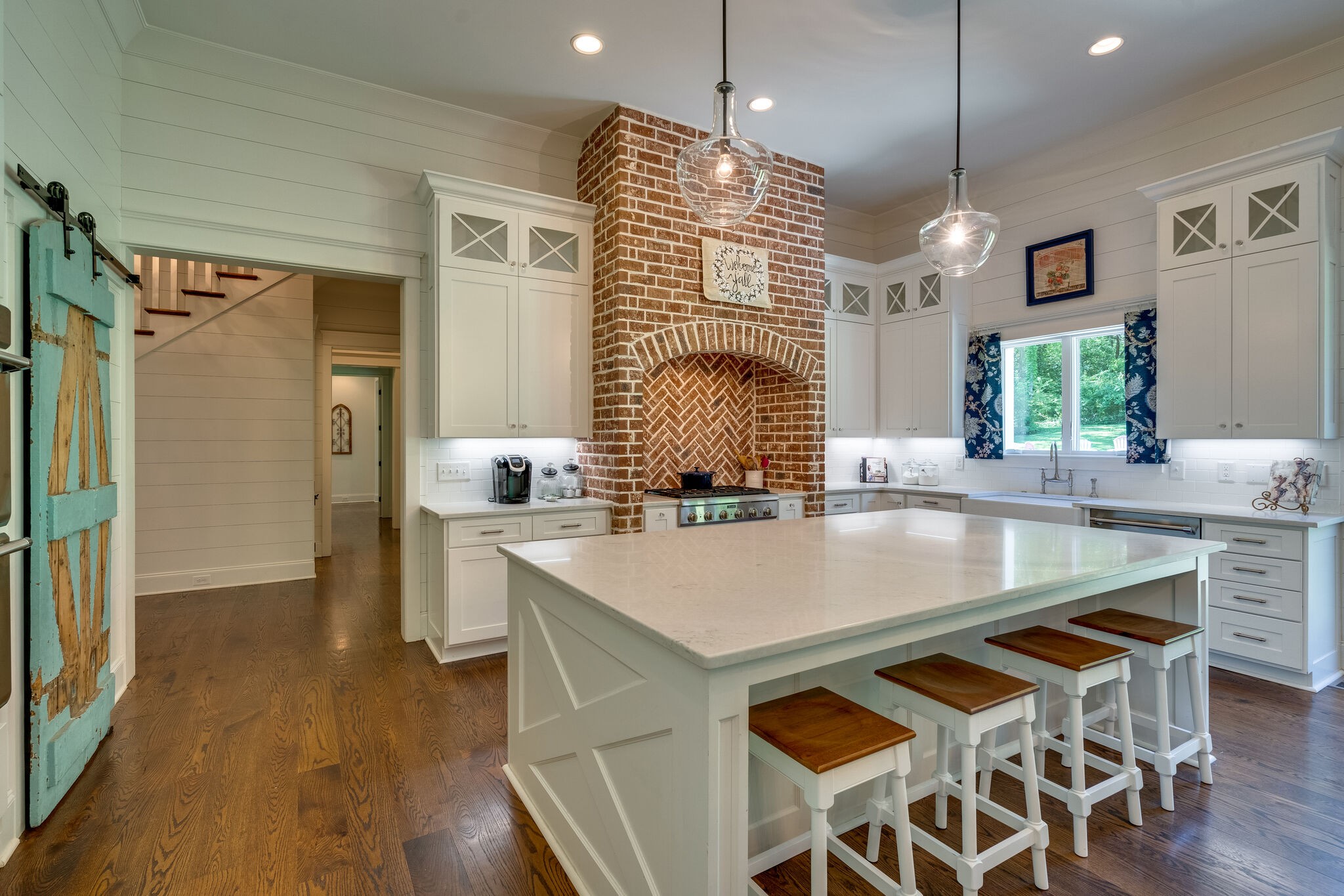 1453 Sneed Road West Franklin, TN 37069 - Photo 22 of 50 a kitchen with stainless steel appliances granite countertop wooden floor window and refrigerator