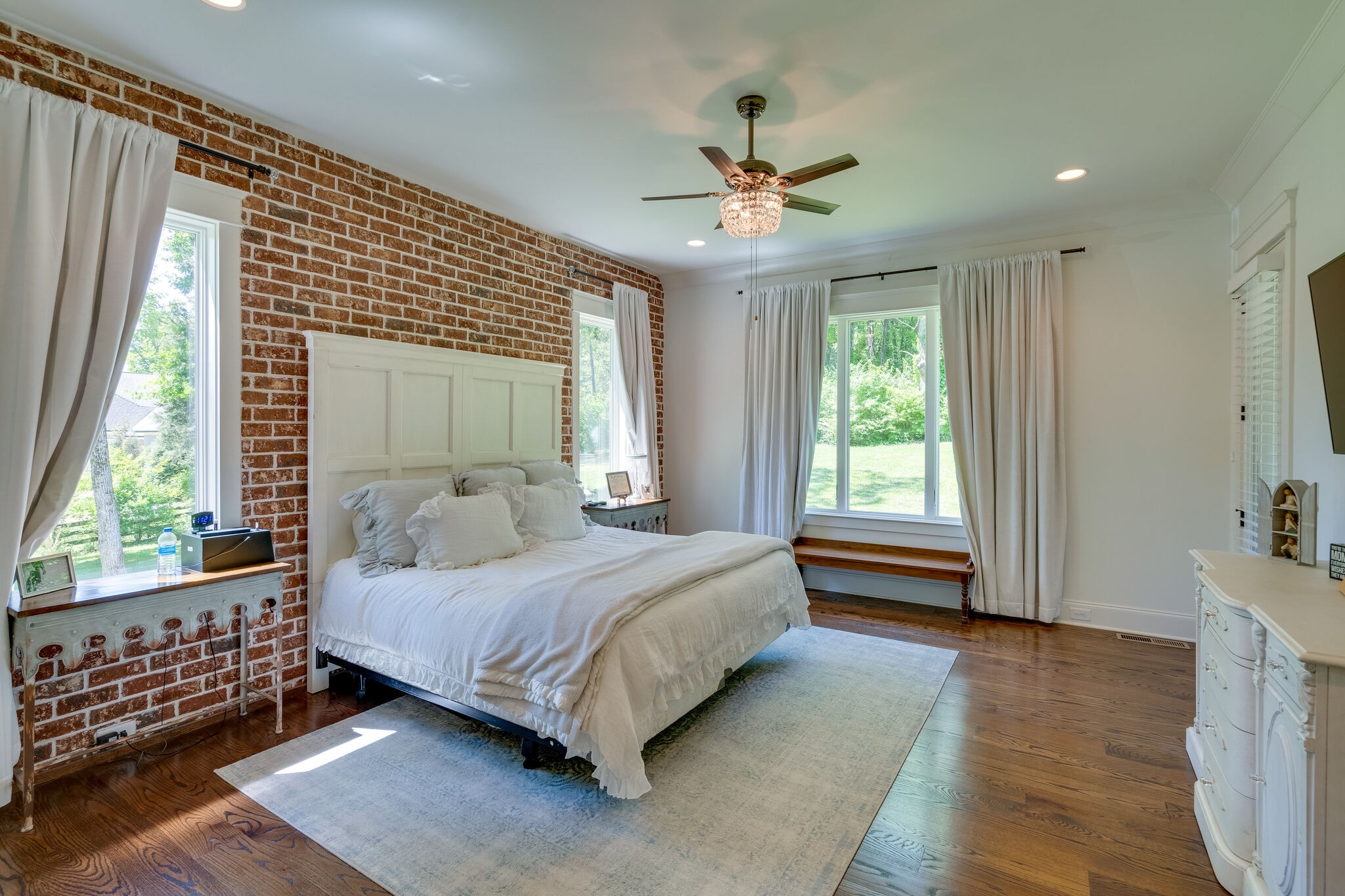 1453 Sneed Road West Franklin, TN 37069 - Photo 27 of 50 a bedroom with a bed and a chandelier
