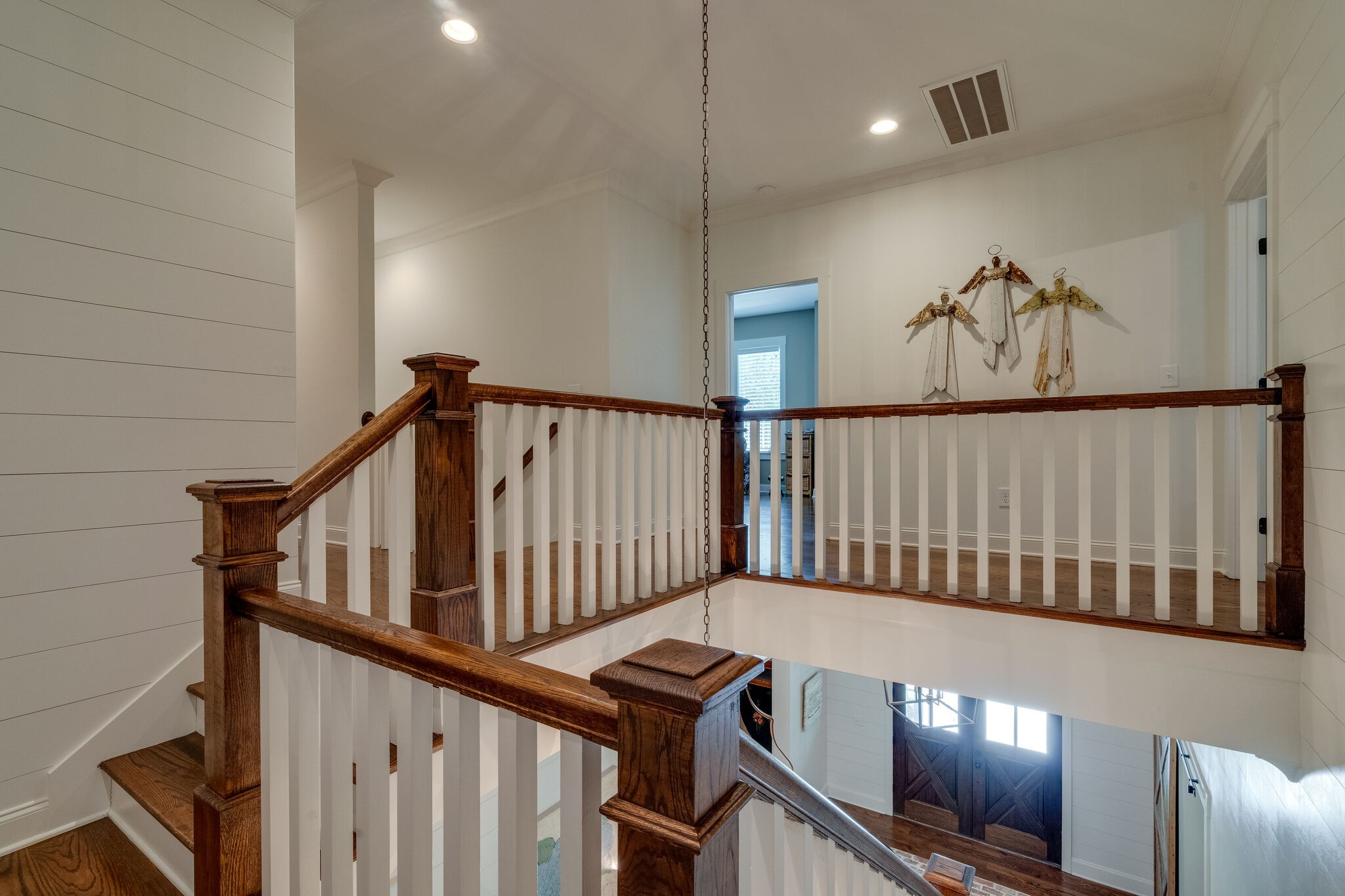1453 Sneed Road West Franklin, TN 37069 - Photo 32 of 50 a view of staircase with lots of frames on wall