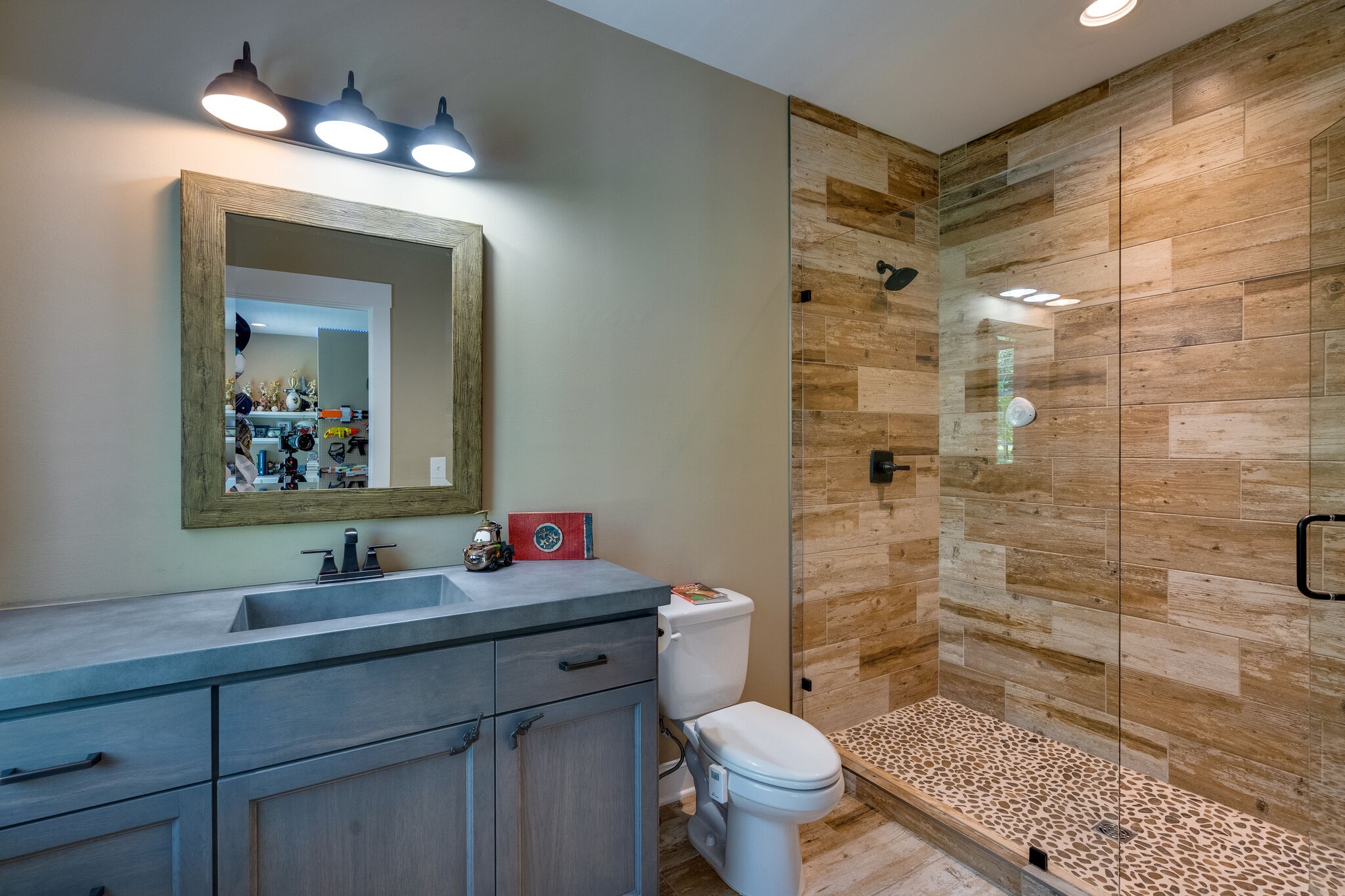 1453 Sneed Road West Franklin, TN 37069 - Photo 37 of 50 a bathroom with a sink toilet vanity and shower