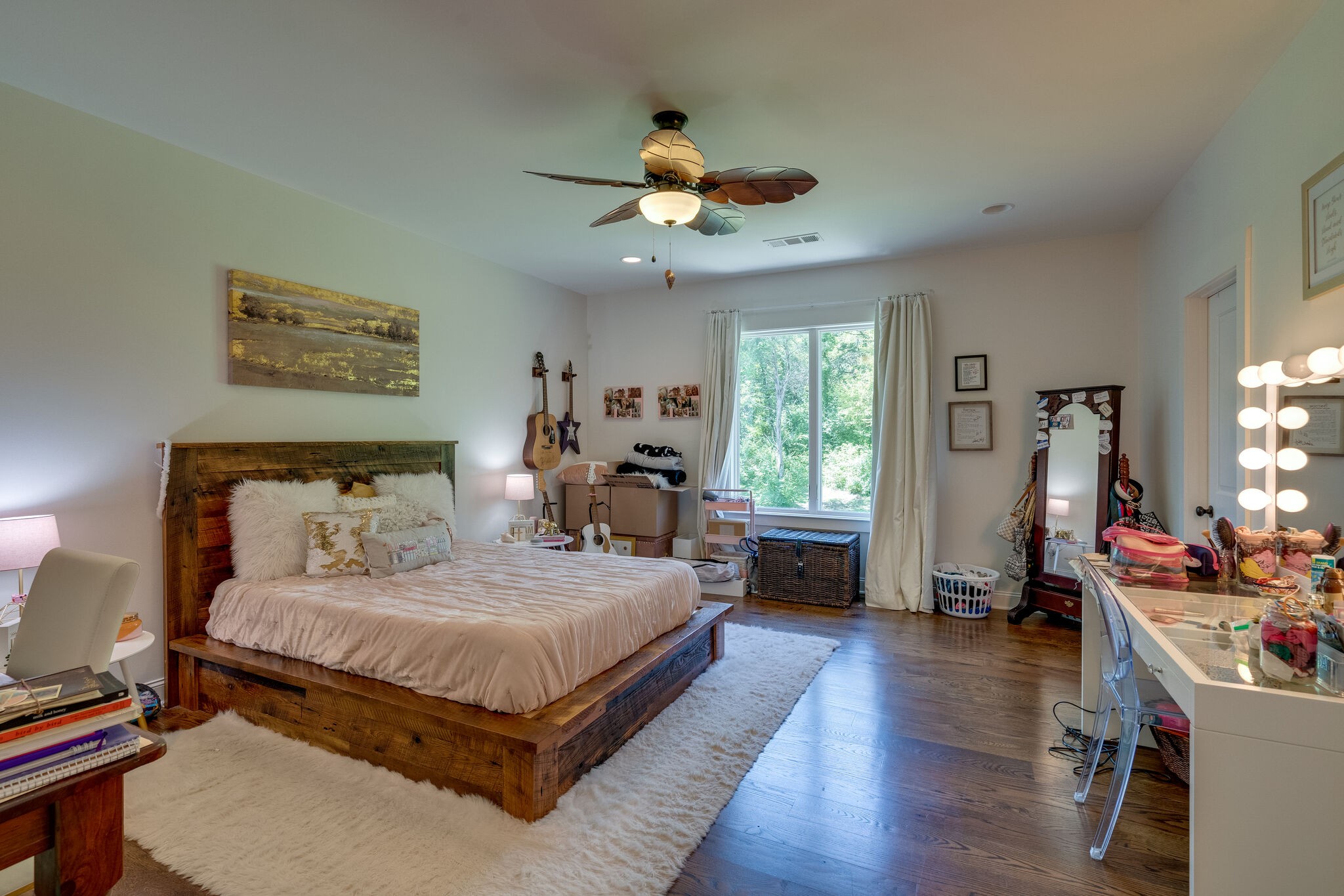1453 Sneed Road West Franklin, TN 37069 - Photo 38 of 50 a bedroom with a bed and a chandelier