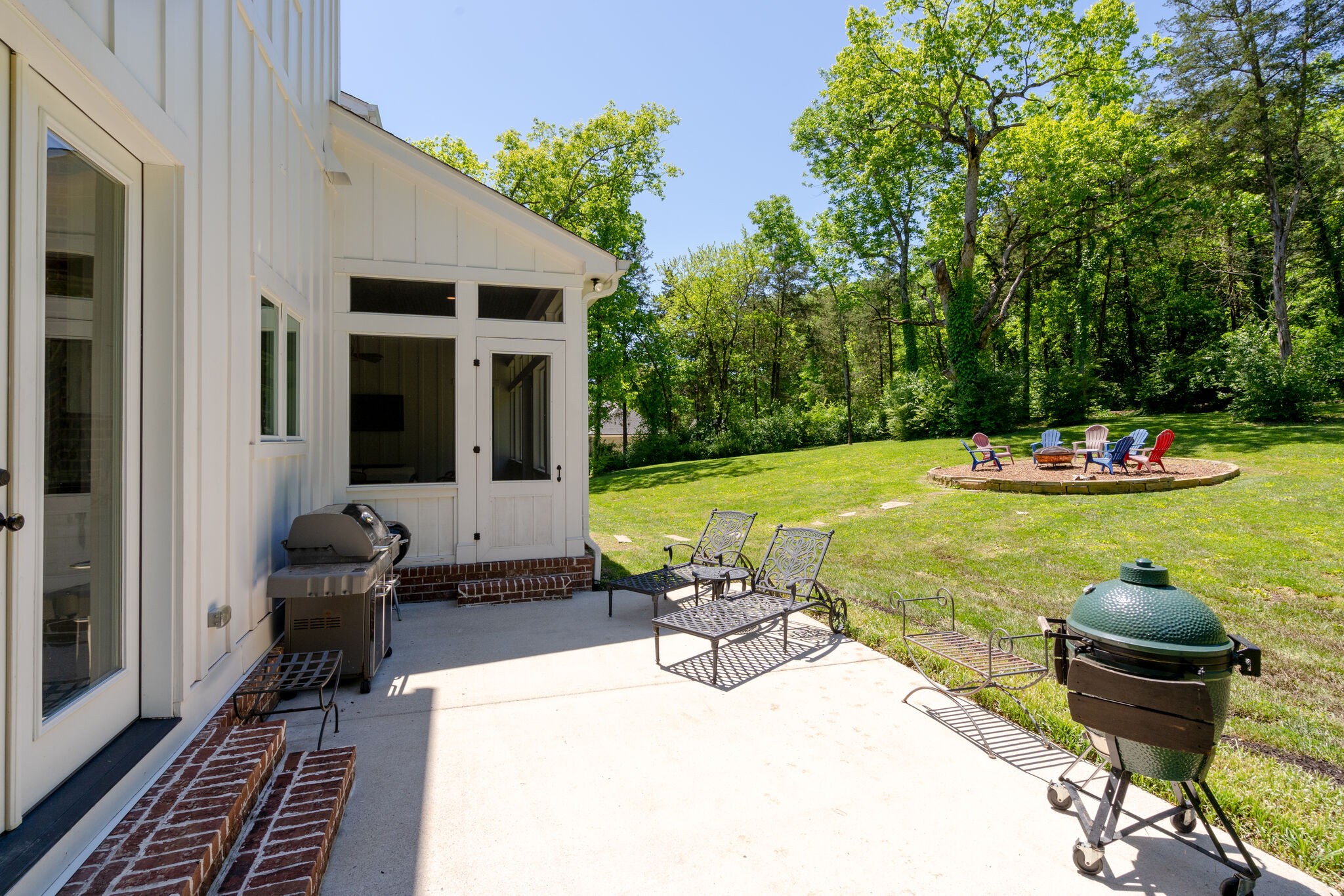 1453 Sneed Road West Franklin, TN 37069 - Photo 47 of 50 a view of a chairs and table in patio with a backyard