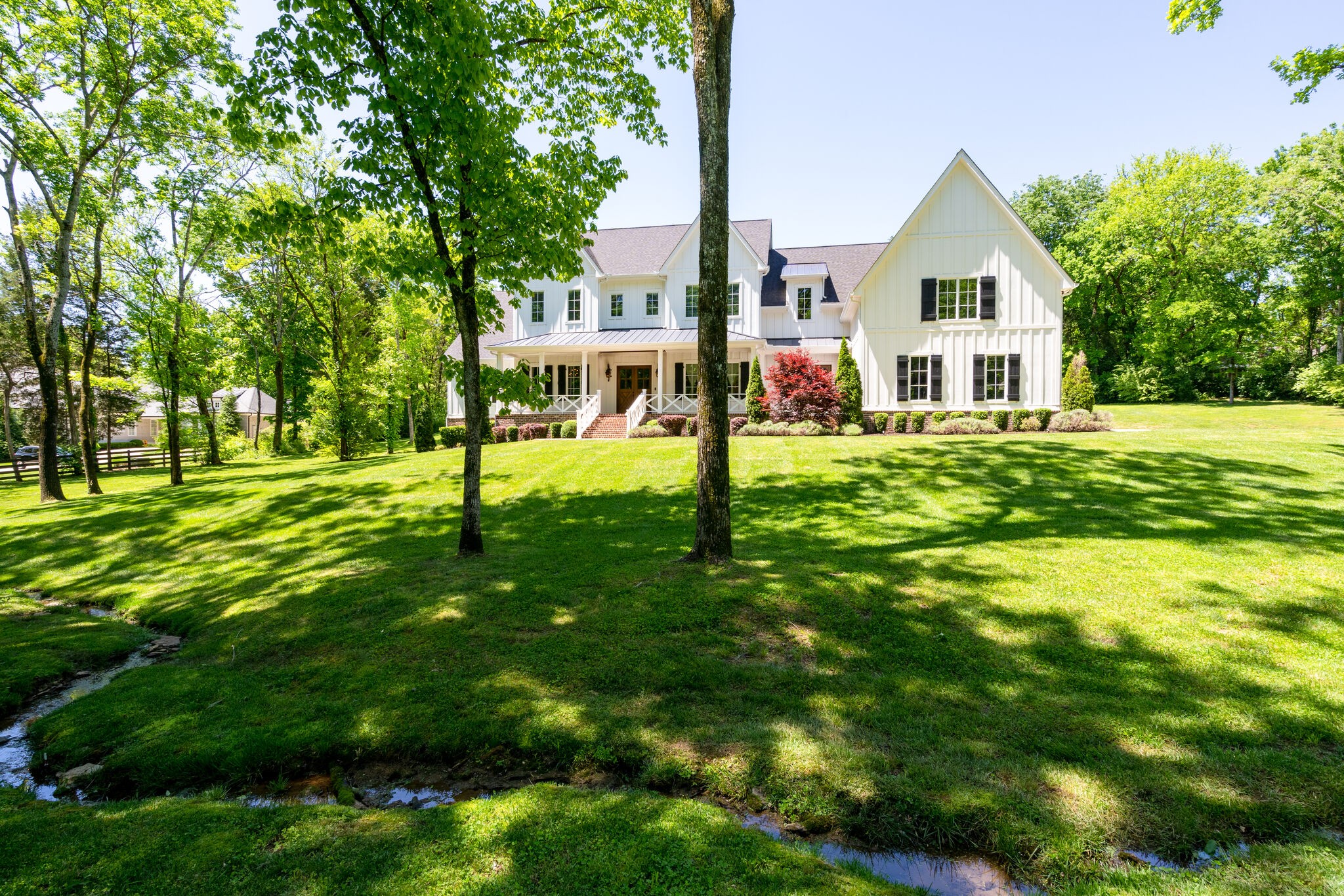 1453 Sneed Road West Franklin, TN 37069 - Photo 6 of 50 a front view of a house with a yard