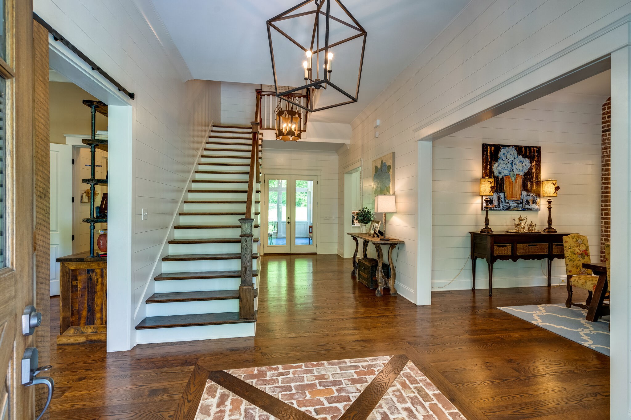 1453 Sneed Road West Franklin, TN 37069 - Photo 9 of 50 a view of dining room with wooden floor and stairs