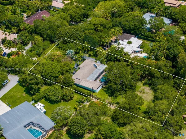 an aerial view of house with yard