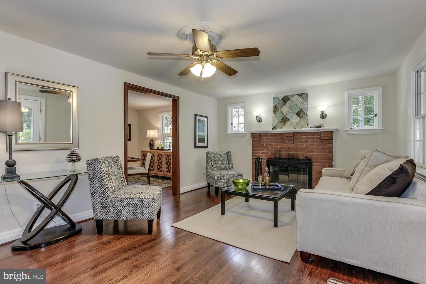 8914 Flower Avenue Silver Spring, MD 20901 - Photo 2 of 25 Living Room with wood burning fireplace
