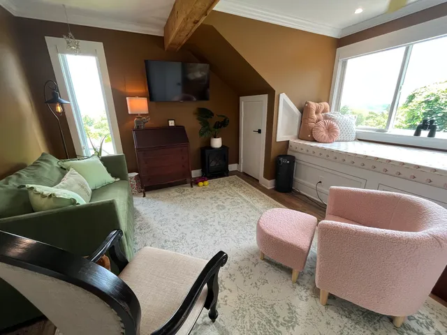 a living room with furniture and a window