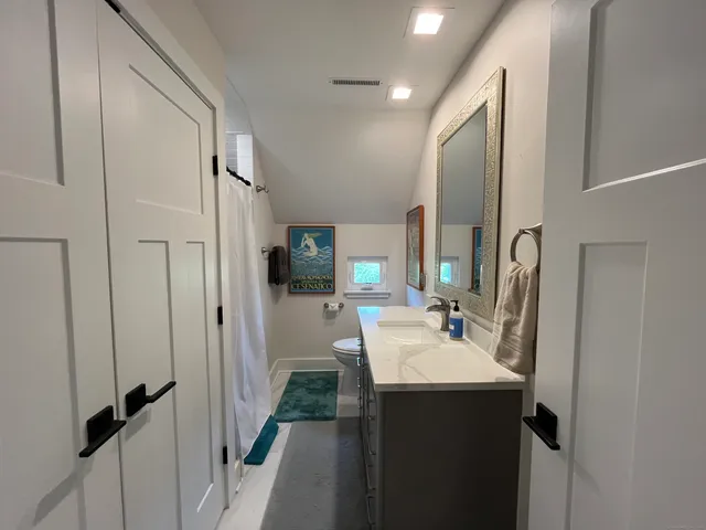 a bathroom with a sink and mirror