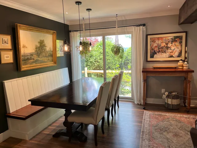 a view of a dining room with furniture window and outside view