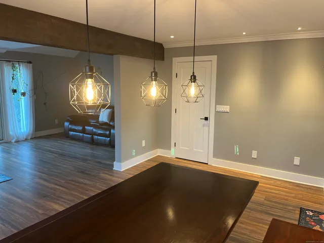 a view of a livingroom with wooden floor