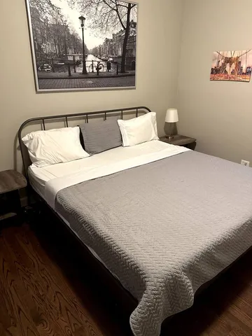 a bedroom with bed and window