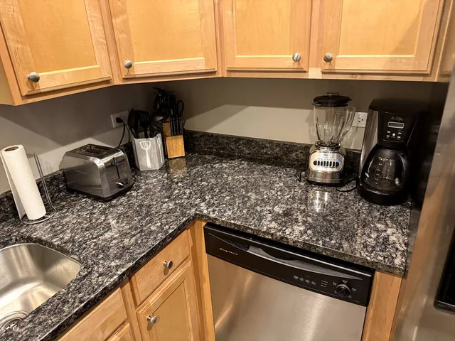 a kitchen with a sink and a stove