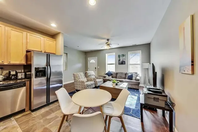 a view of a dining room with furniture window and wooden floor