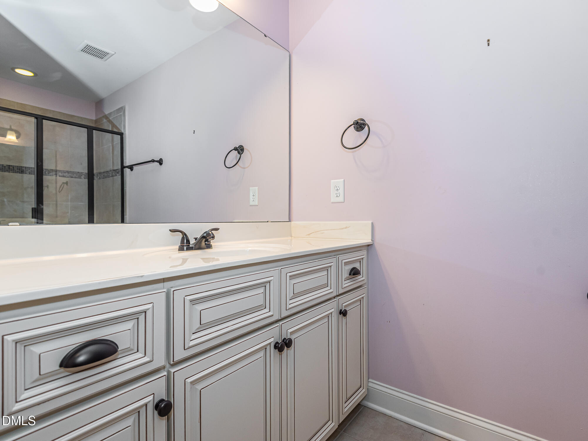 337 Shadowdale Lane Rolesville, NC 27571 - Photo 28 of 42 a bathroom with a sink a vanity and mirror