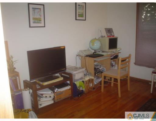 4405 Hana Road Edison, NJ 08817 - Photo 3 of 9 a living room with furniture and wooden floor