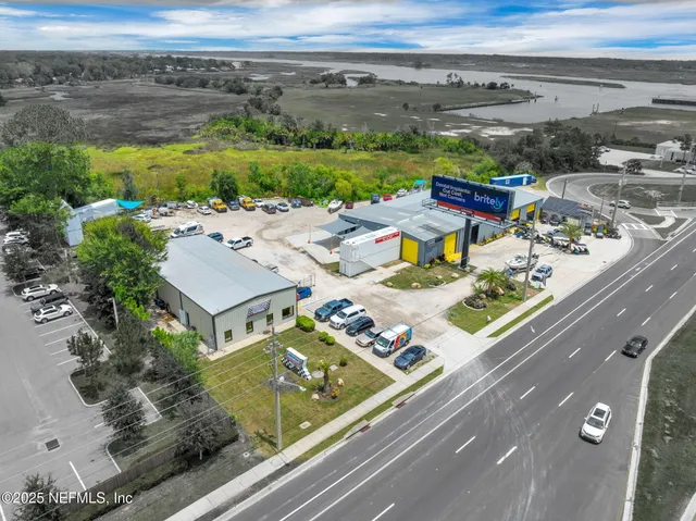 an aerial view of a house with a yard