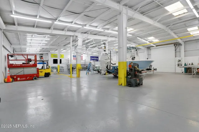 a view of a patio with table and chairs