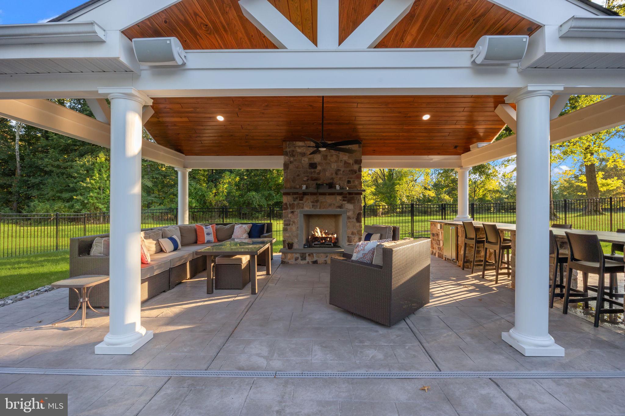 7 Woodland Road Newtown, PA 18940 - Photo 11 of 137 a living room with fireplace furniture and a floor to ceiling window