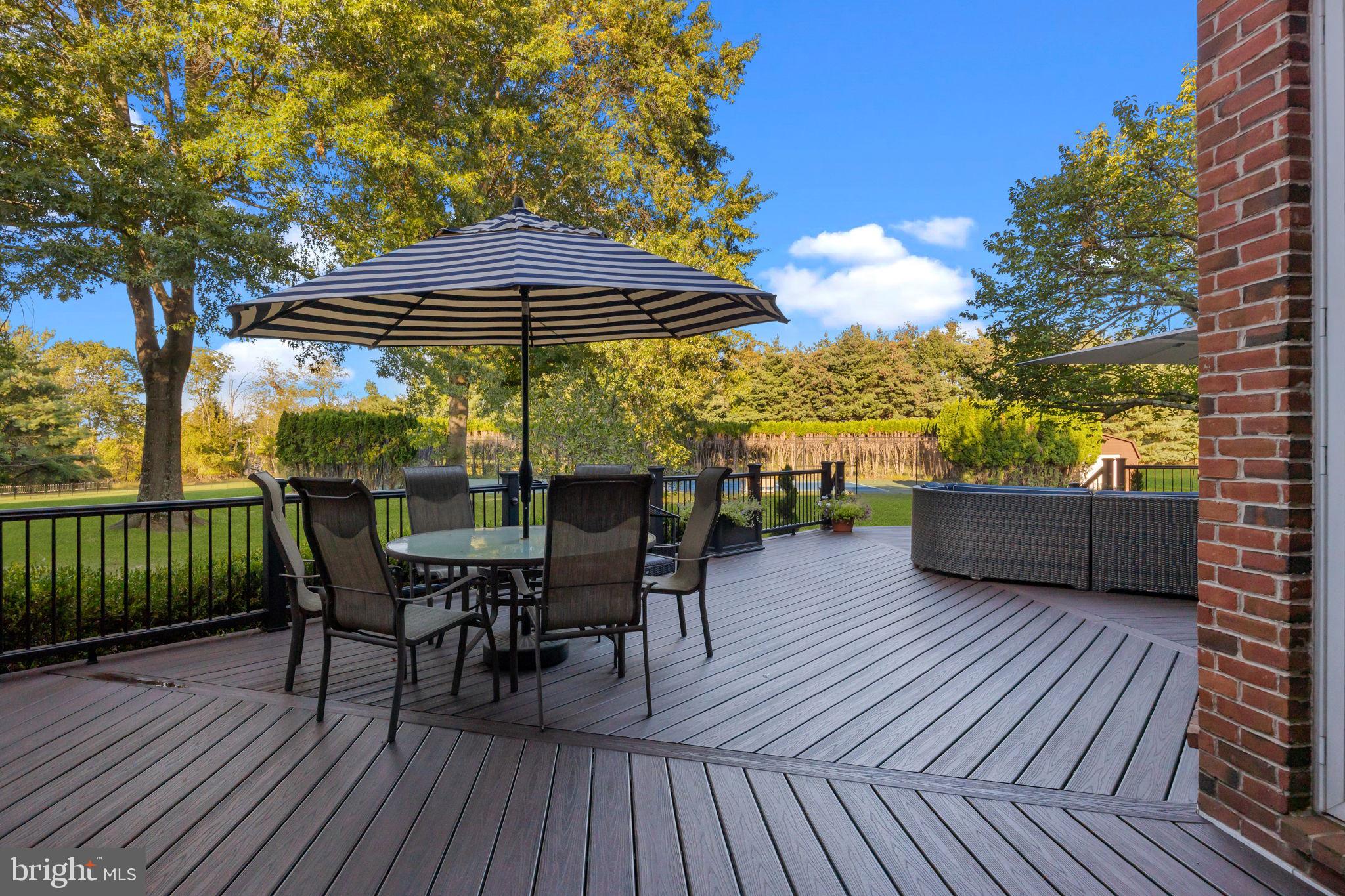 7 Woodland Road Newtown, PA 18940 - Photo 122 of 137 a view of a chairs and table on the wooden roof deck