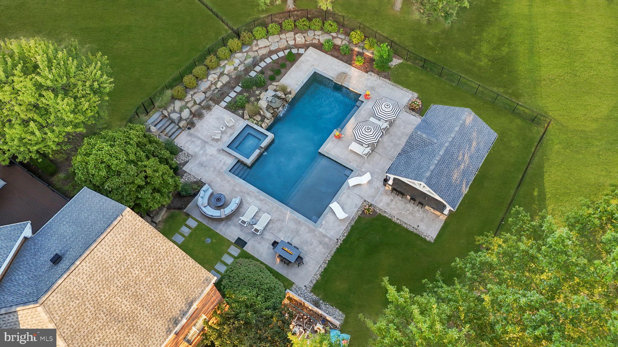 7 Woodland Road Newtown, PA 18940 - Photo 124 of 137 an aerial view of a house with a swimming pool and outdoor space