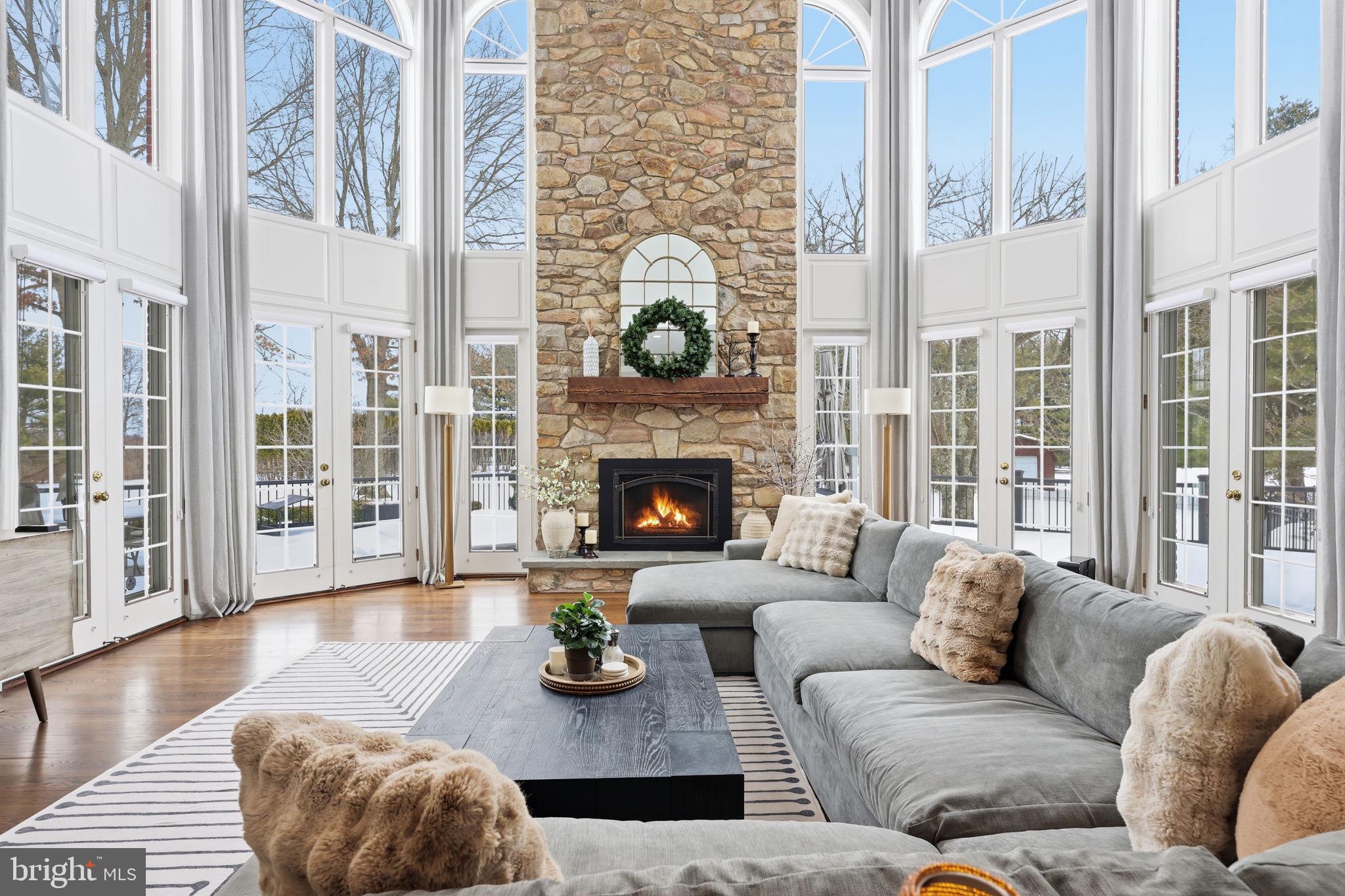 7 Woodland Road Newtown, PA 18940 - Photo 27 of 137 a living room with furniture fireplace and wooden floor