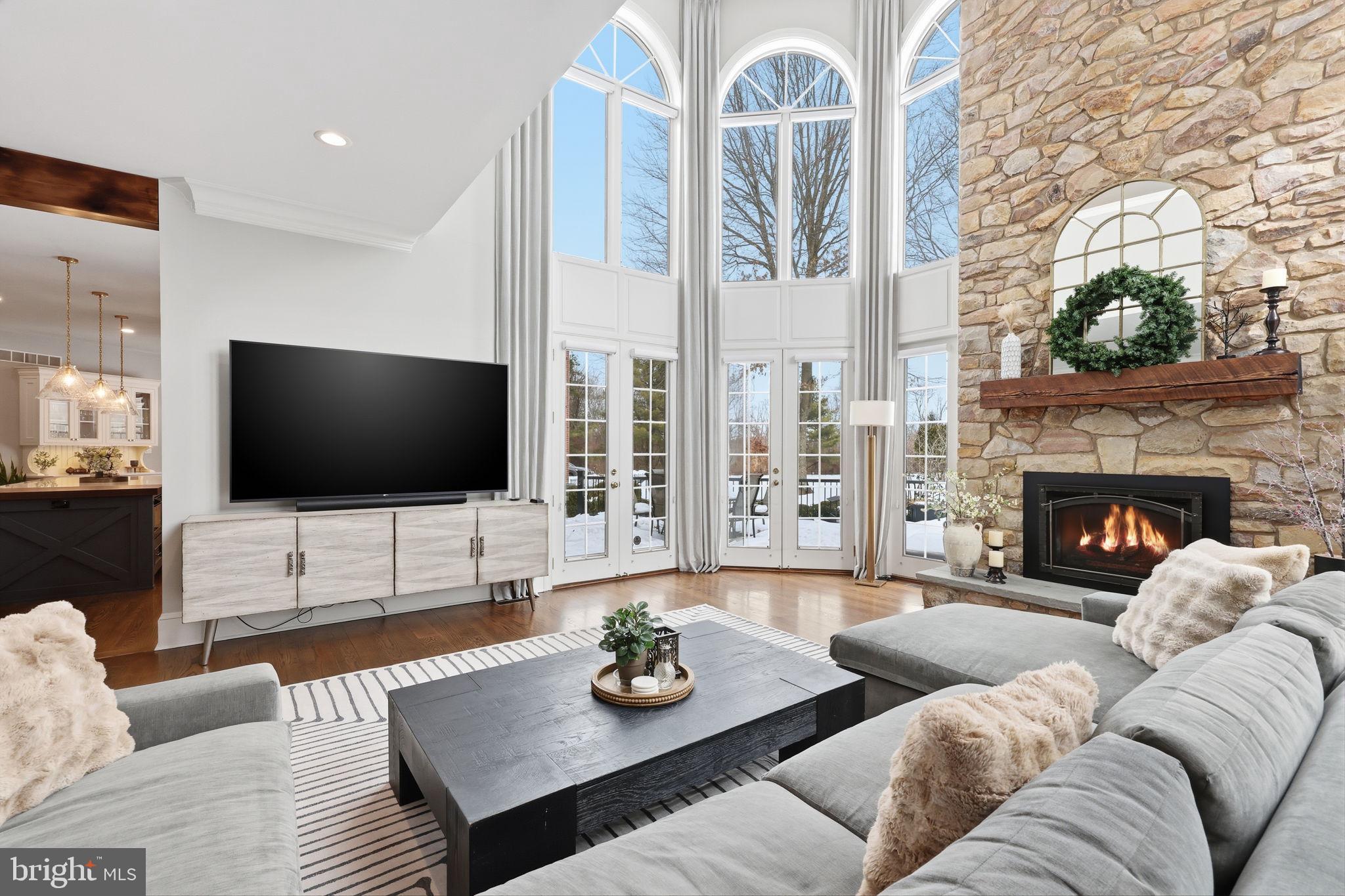 7 Woodland Road Newtown, PA 18940 - Photo 28 of 137 a living room with fireplace furniture and a flat screen tv