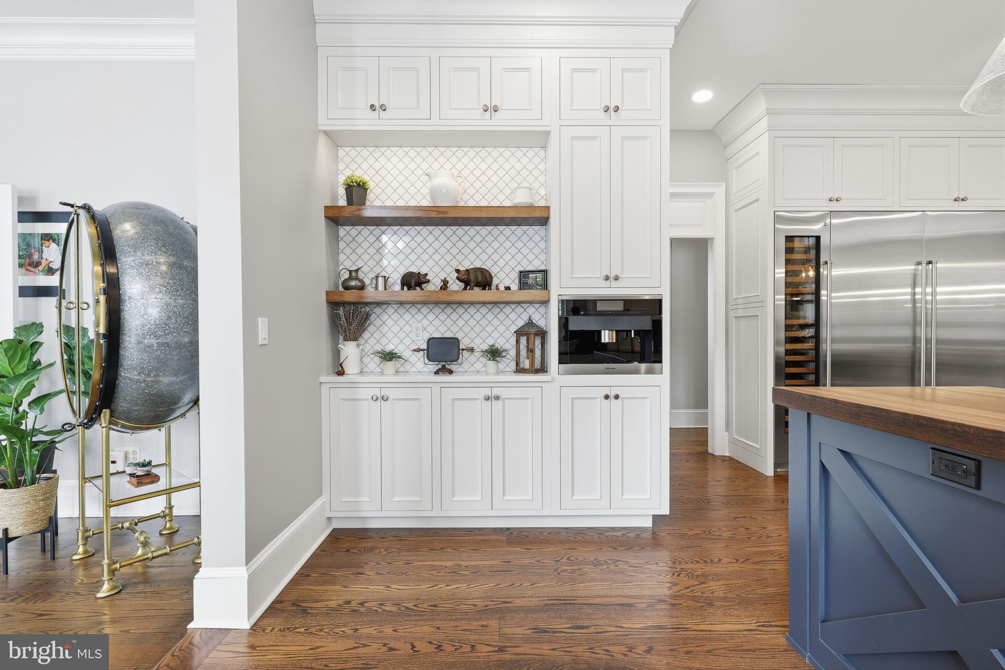 7 Woodland Road Newtown, PA 18940 - Photo 36 of 137 a kitchen with stainless steel appliances granite countertop a refrigerator and a stove top oven
