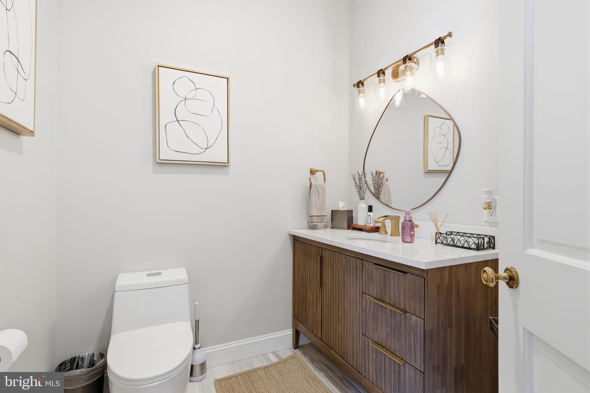 7 Woodland Road Newtown, PA 18940 - Photo 46 of 137 a bathroom with a toilet a sink and a mirror