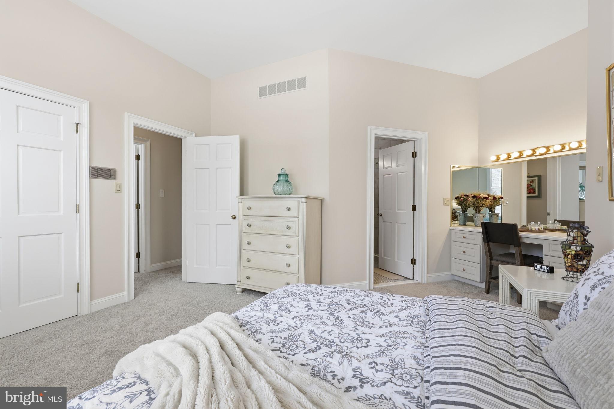 7 Woodland Road Newtown, PA 18940 - Photo 52 of 137 a bedroom with a bed and a dresser