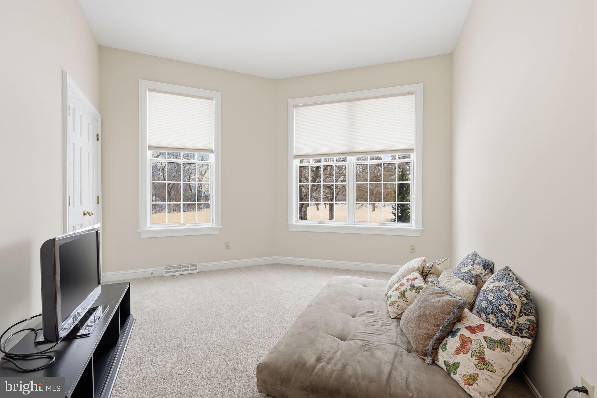7 Woodland Road Newtown, PA 18940 - Photo 57 of 137 a bed sitting in a bedroom next to a window